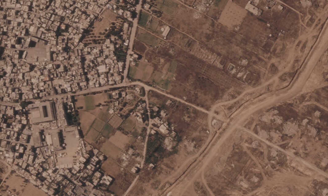 Israel is building a miles-long earthen barrier inside Gaza, entrenching its division
